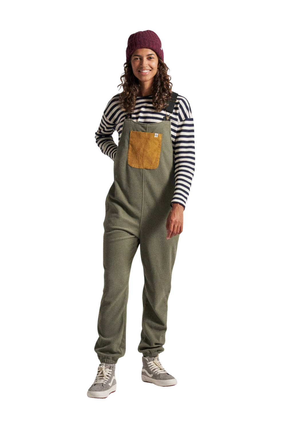 Person wearing green overalls and a striped shirt on a white background