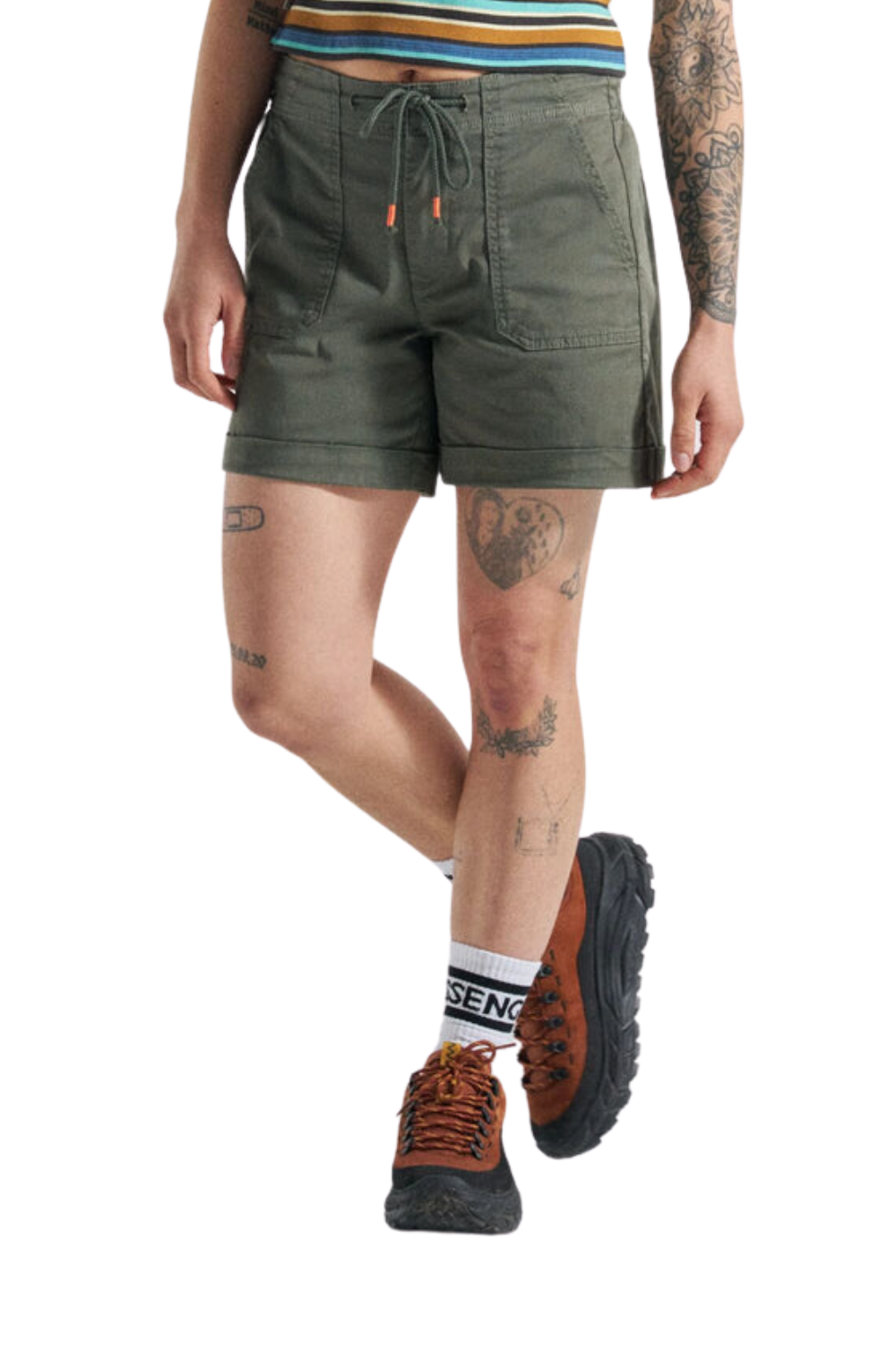 Person wearing green shorts, striped shirt, and hiking boots on a white background