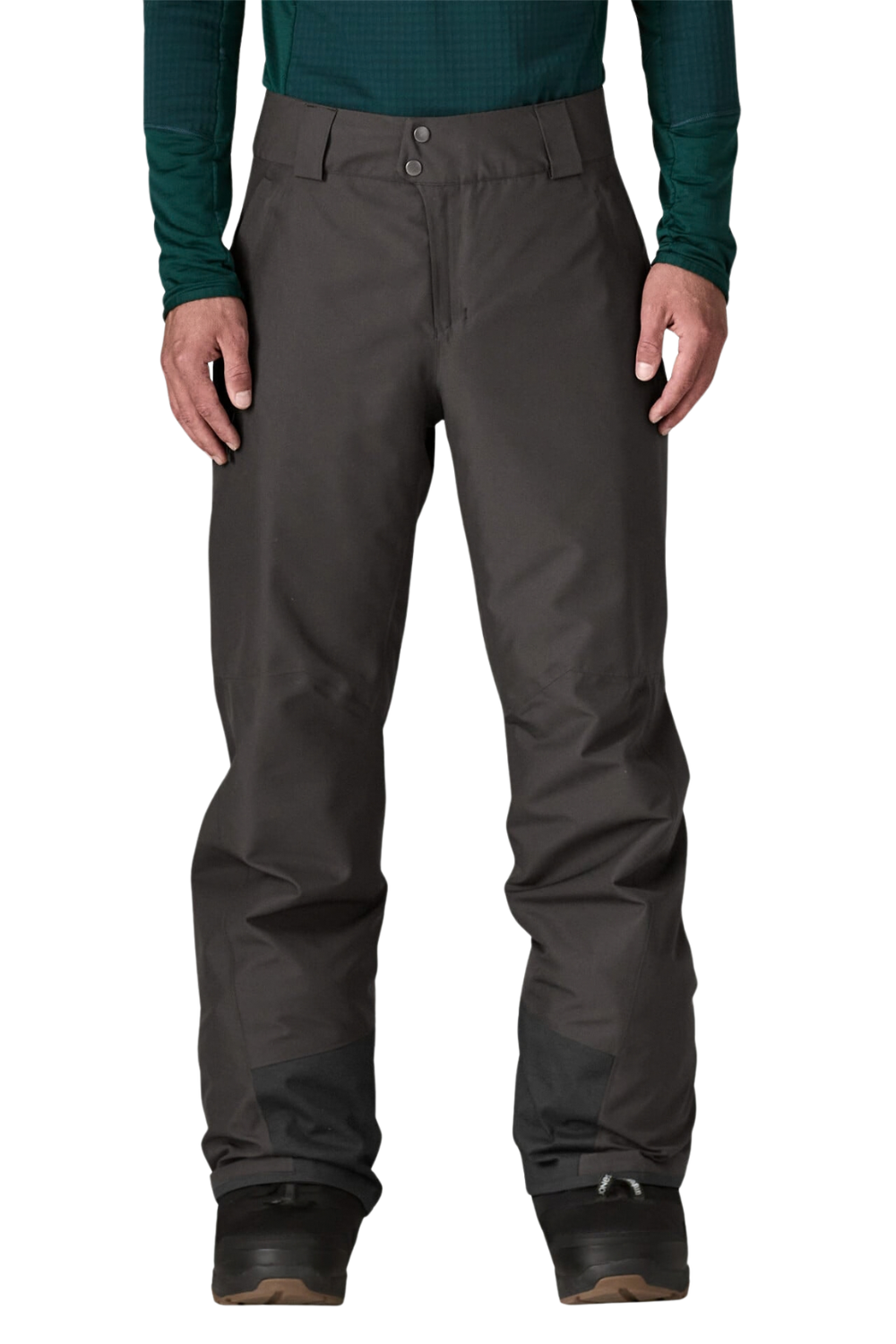 A person wearing dark charcoal gray snow pants with a dark green long-sleeve shirt and black boots, shown from the waist down against a plain white background.