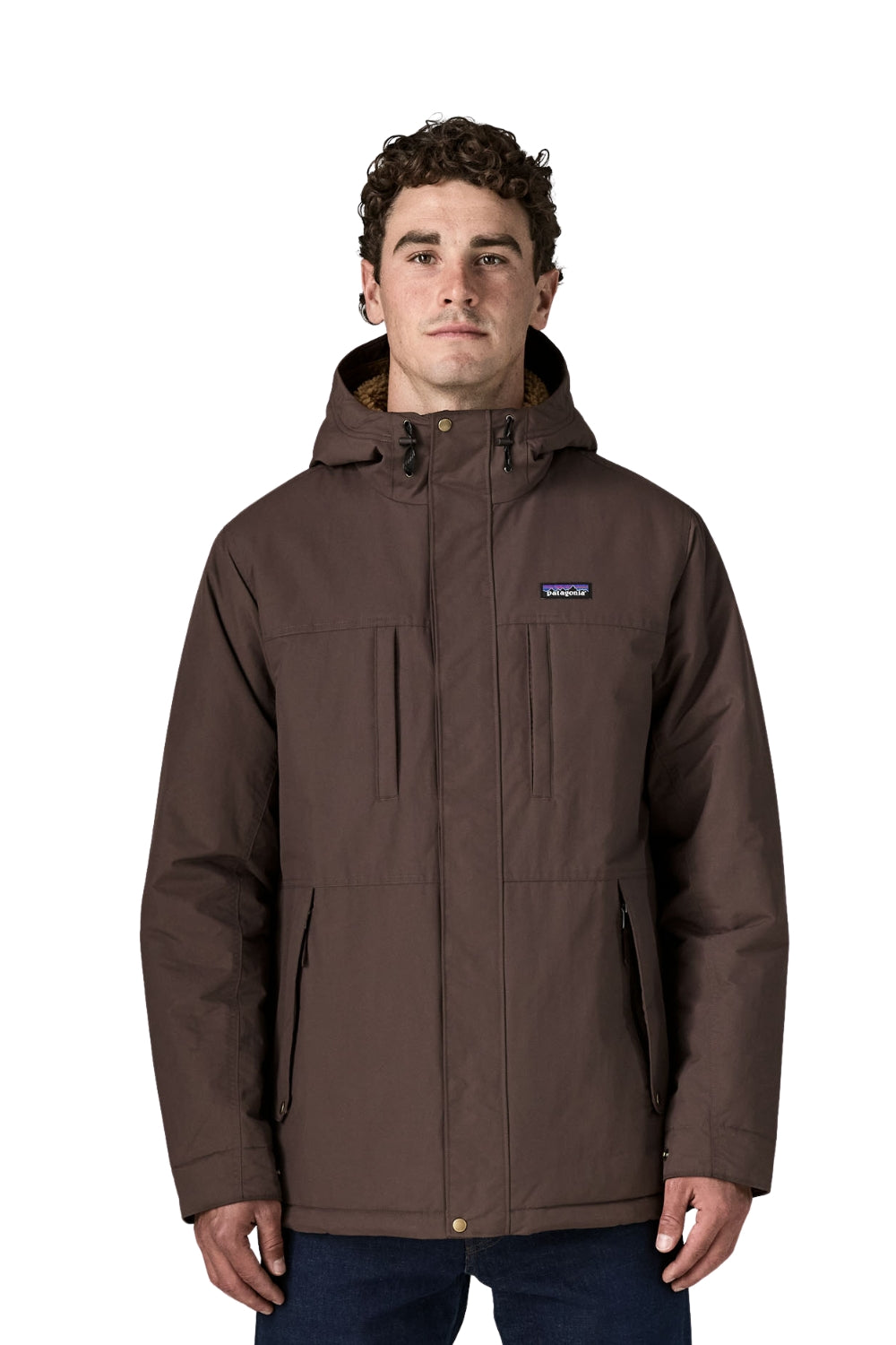A man wearing a brown Patagonia hooded jacket with zippered pockets, shown against a plain white background.
