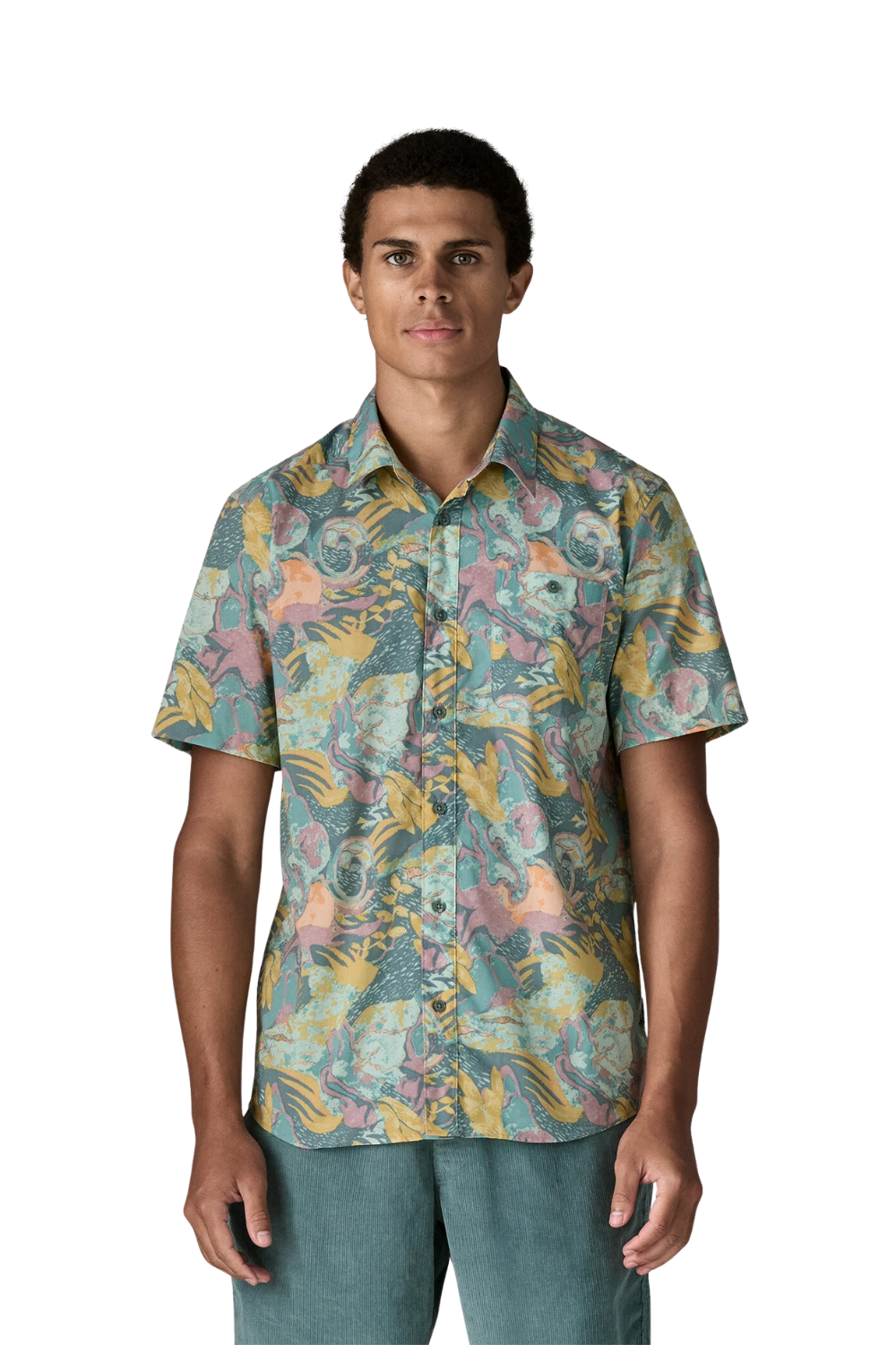 Man wearing a colorful patterned shirt on a white background