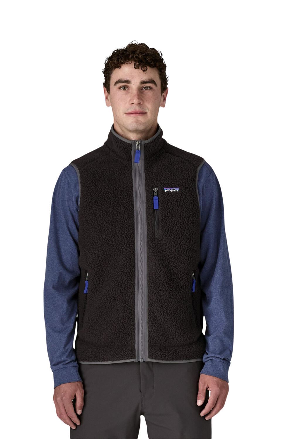 Man wearing a black and blue jacket with a white background