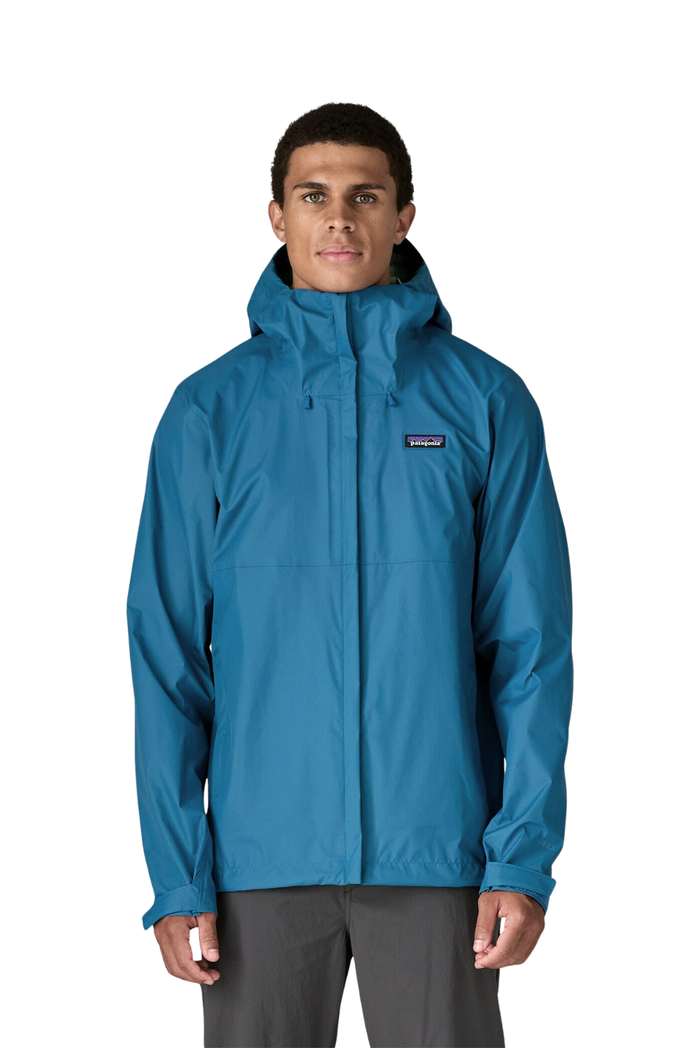 Person wearing a blue rain jacket with a visible brand logo on a white background