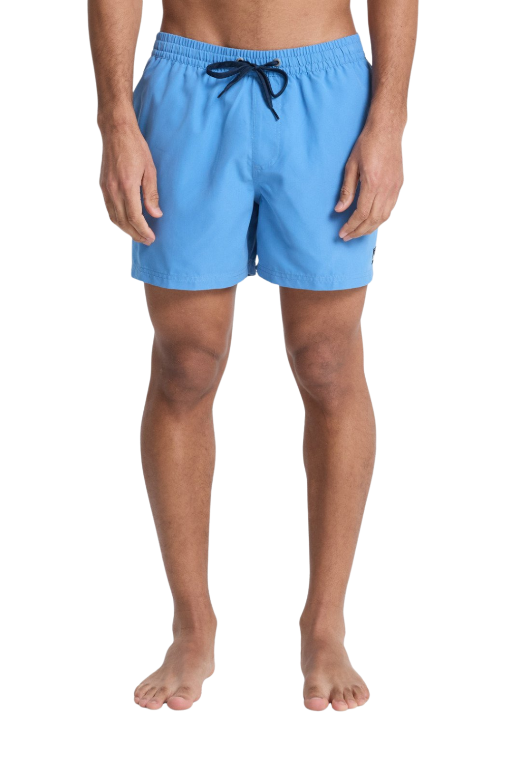 Person wearing blue swim shorts on a white background