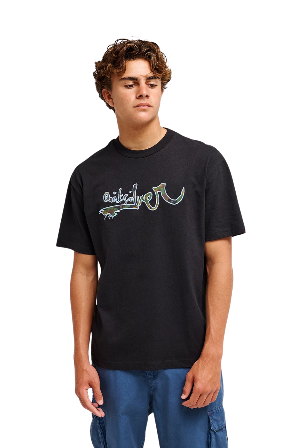 A young man wearing a black short-sleeve t-shirt with a stylized graphic logo on the chest, paired with blue cargo pants, photographed against a solid white background.