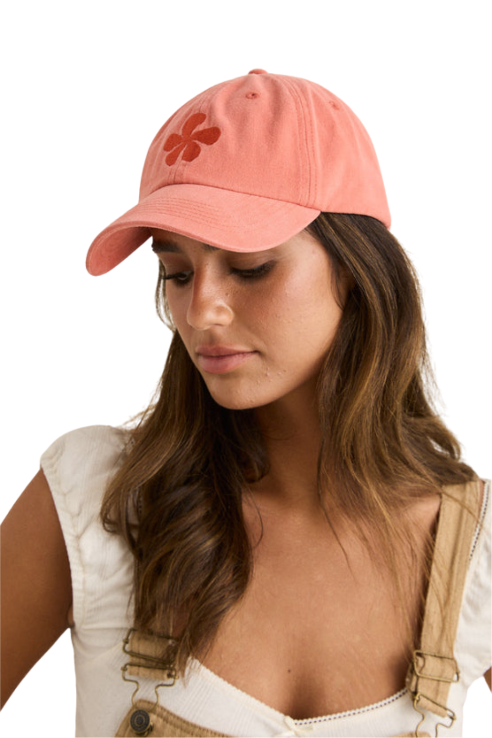 Coral coloured cap with a red flower on the front