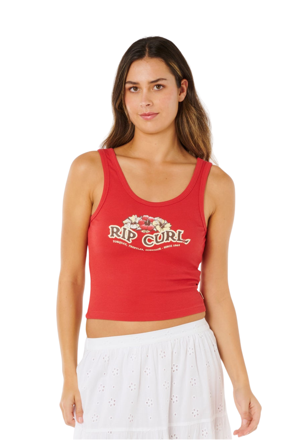 Womean wearing a red vest top with a floral graphic print and Rip Curl logo on the chest