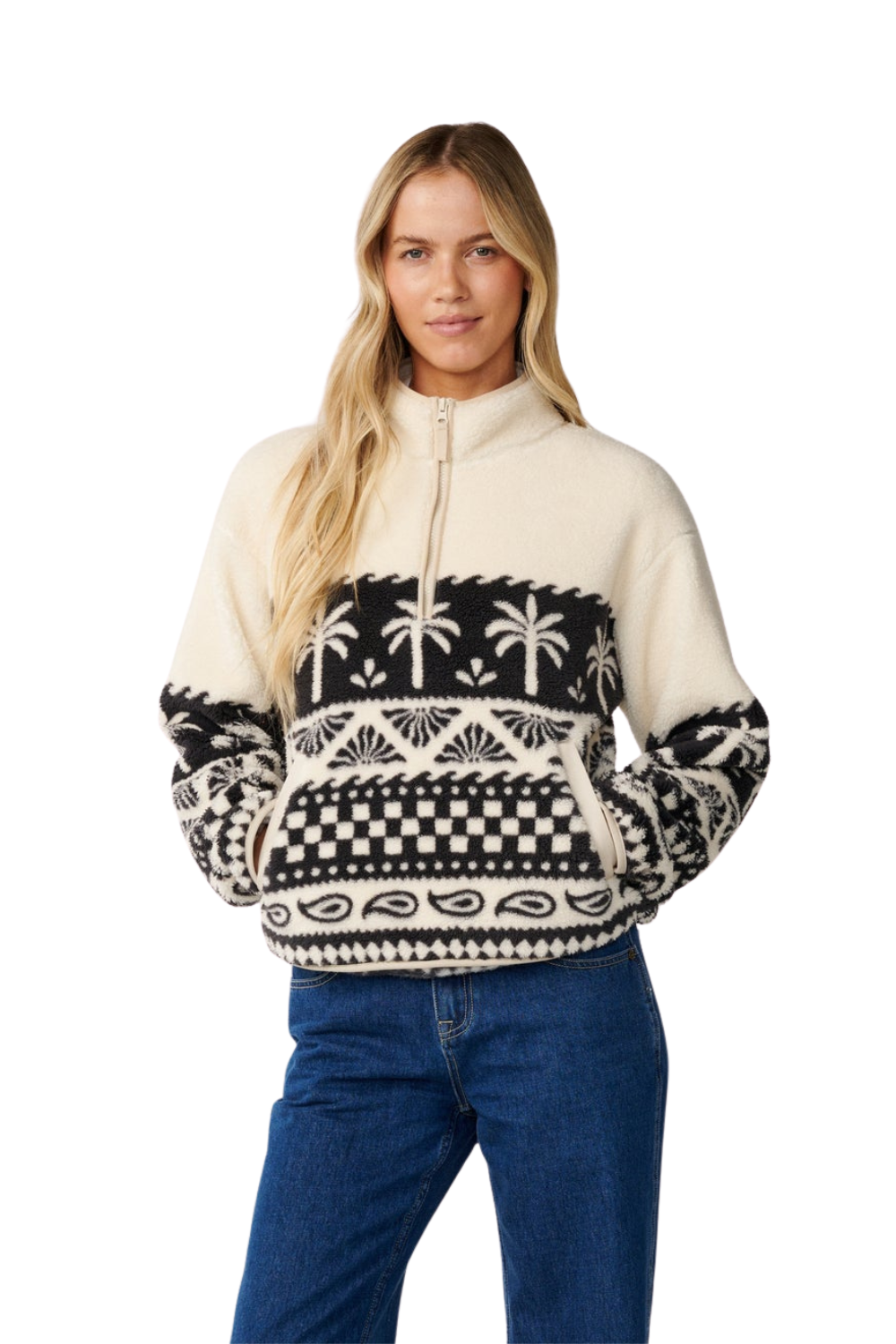 A woman wearing a Rip Curl  1/4 Zip Polar Fleece in white with a black geometrical palm tree pattern 