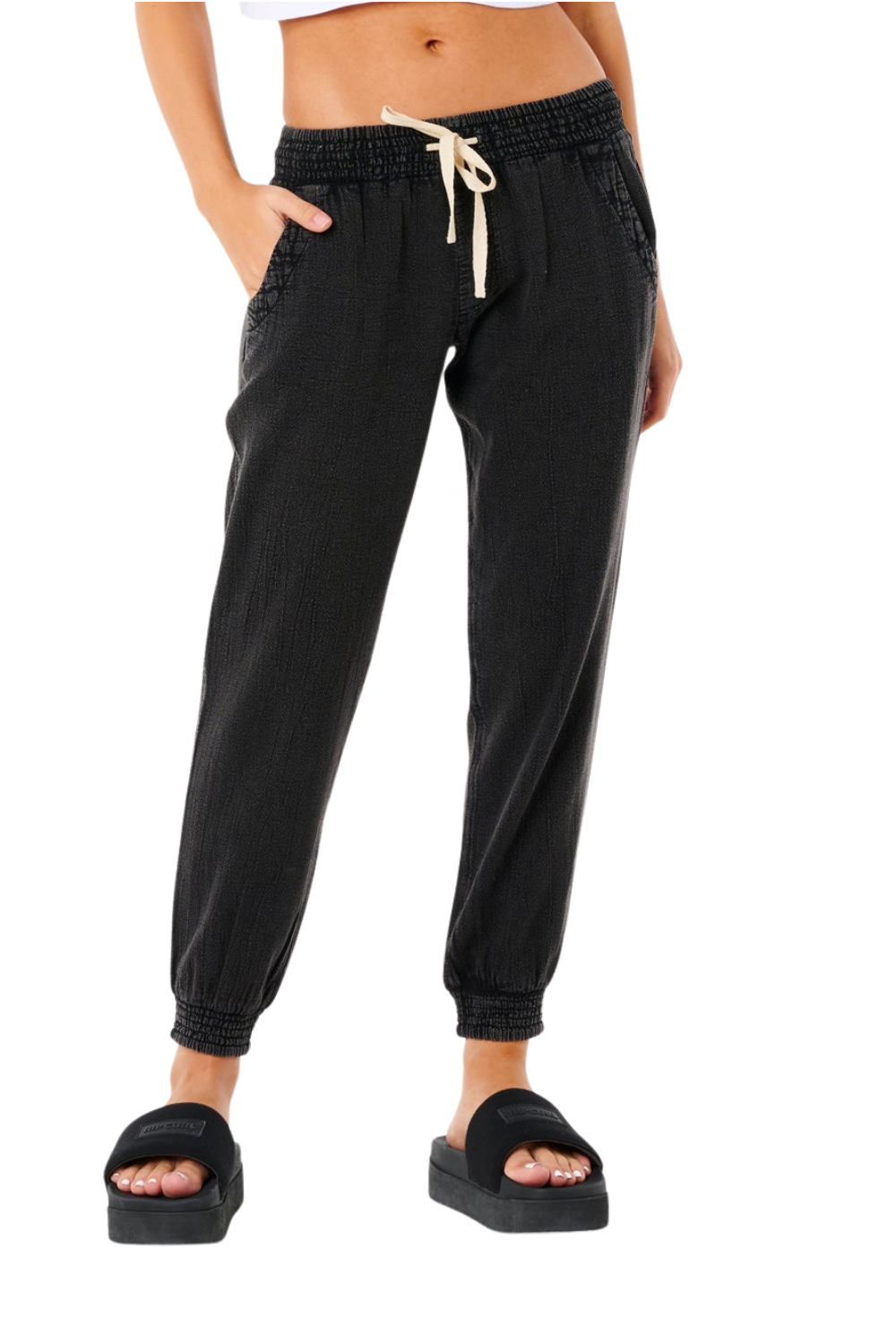 Black jogger pants with a drawstring on a white background