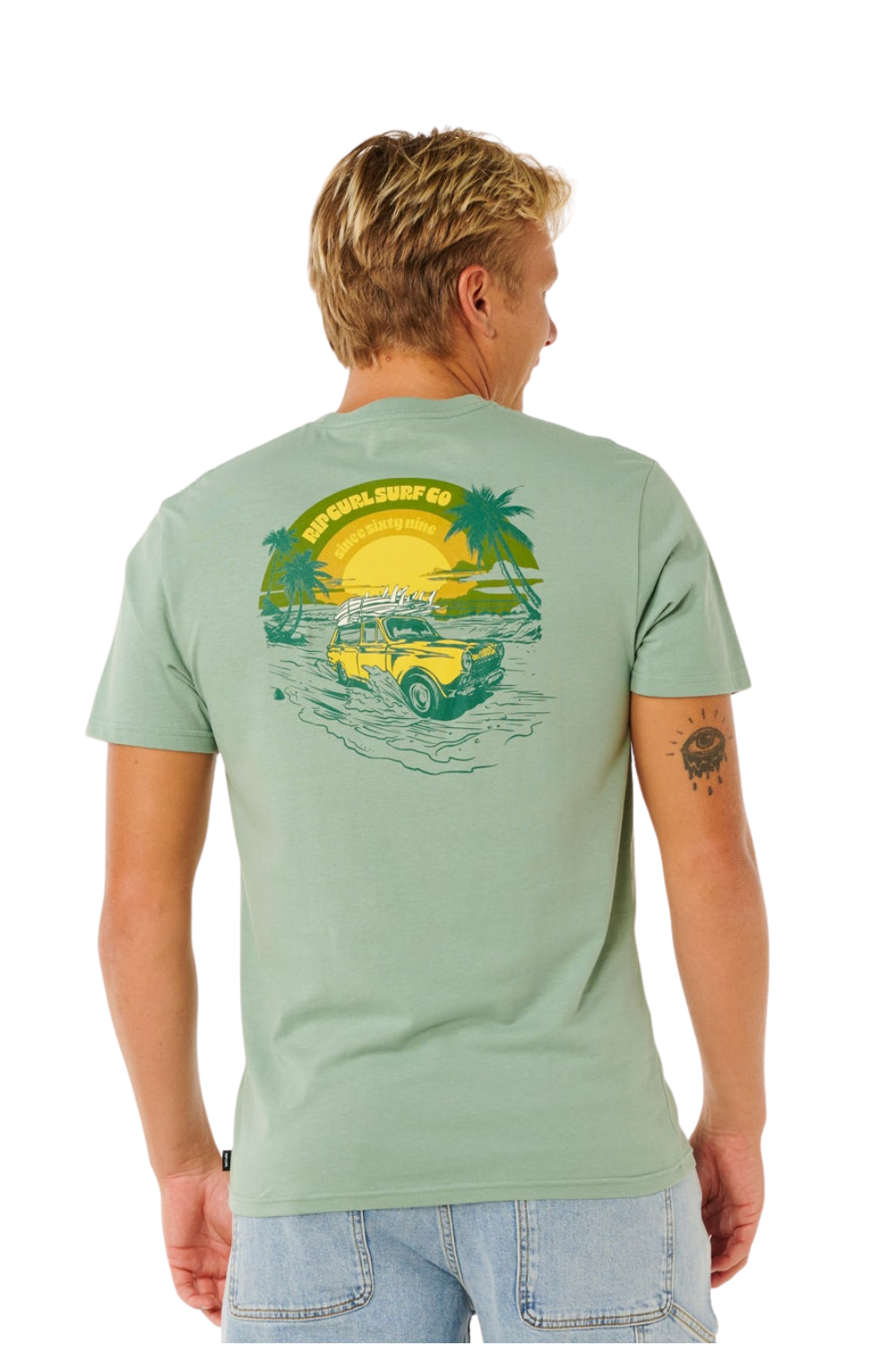 Person wearing a green t-shirt with bold graphics on the back