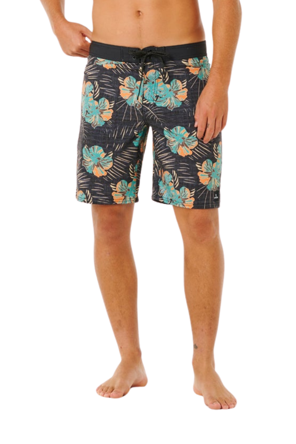 Person wearing tropical patterned shorts on a white background