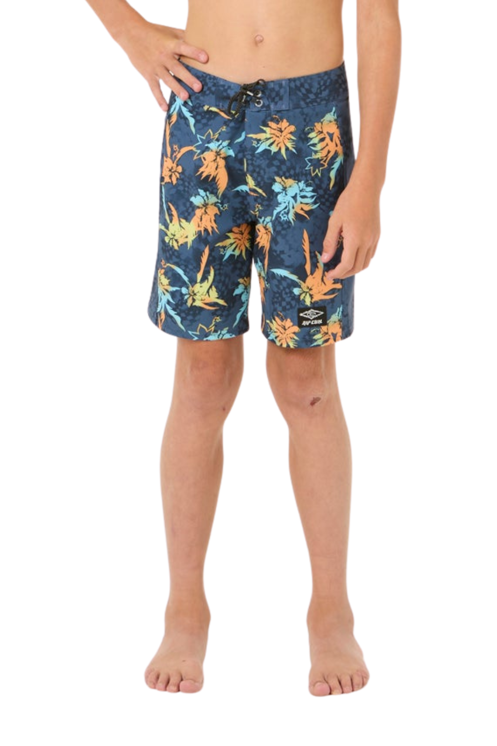 A child modeling blue swim trunks with a colorful tropical floral print, shown from the waist down on a white background.
