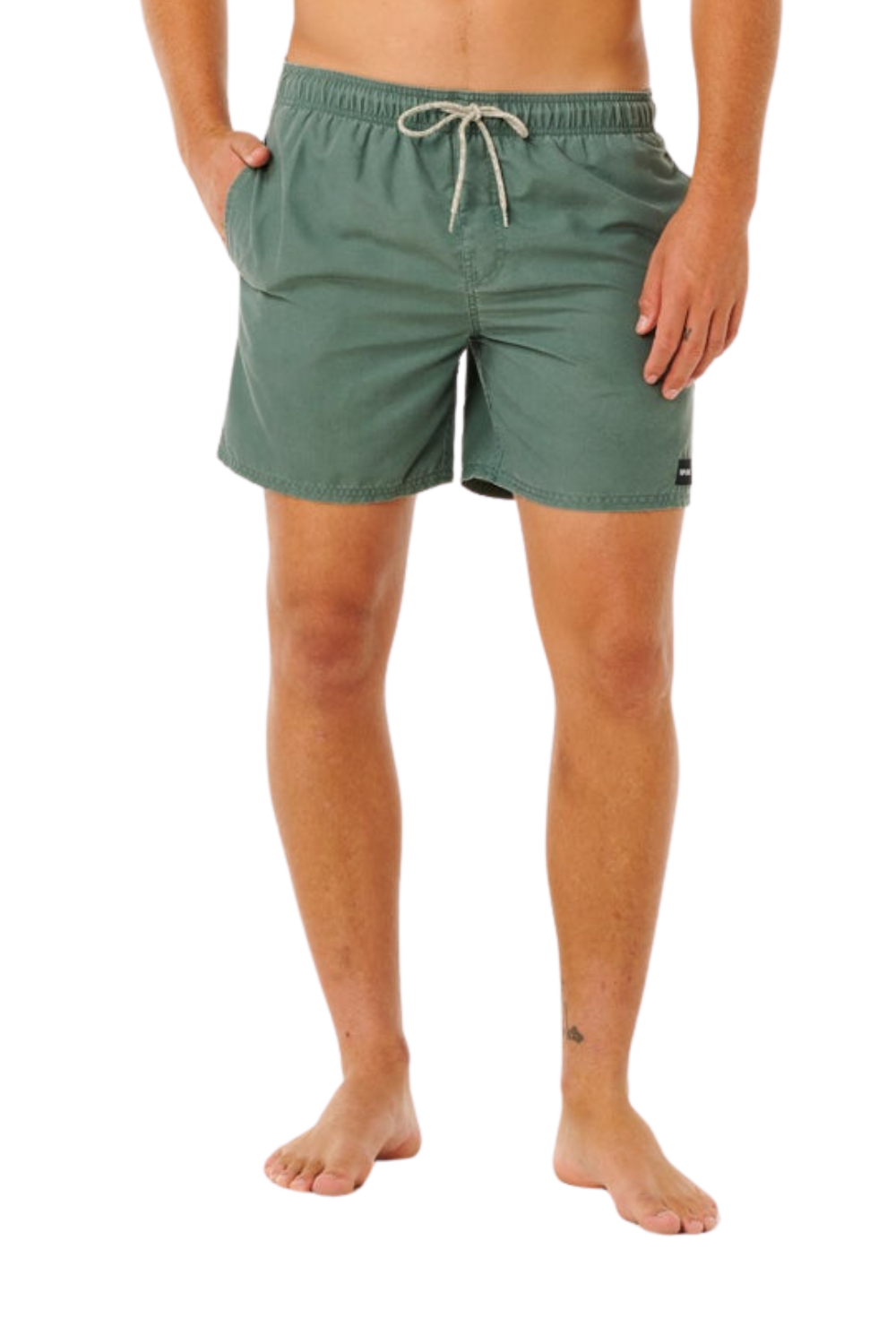 Person wearing green shorts on a white background