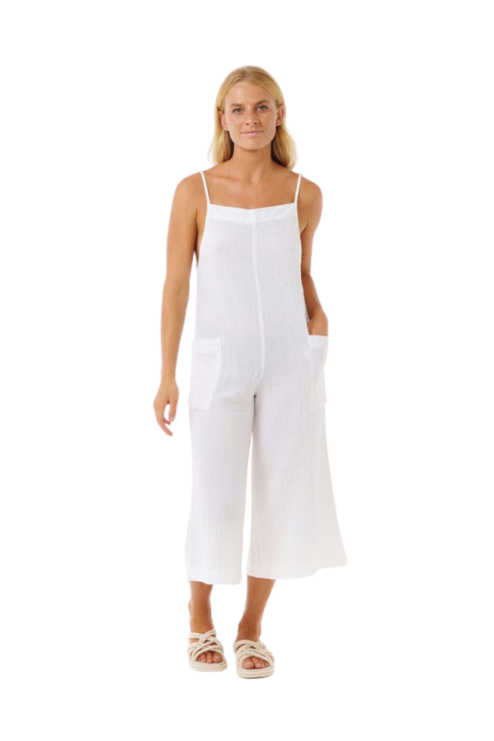 Woman wearing a white jumpsuit on a white background