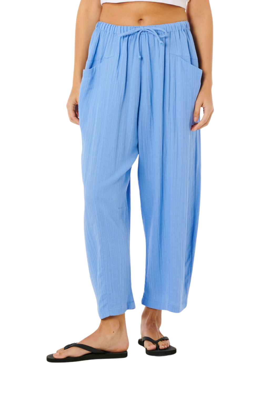 Light blue pants worn by a person on a white background