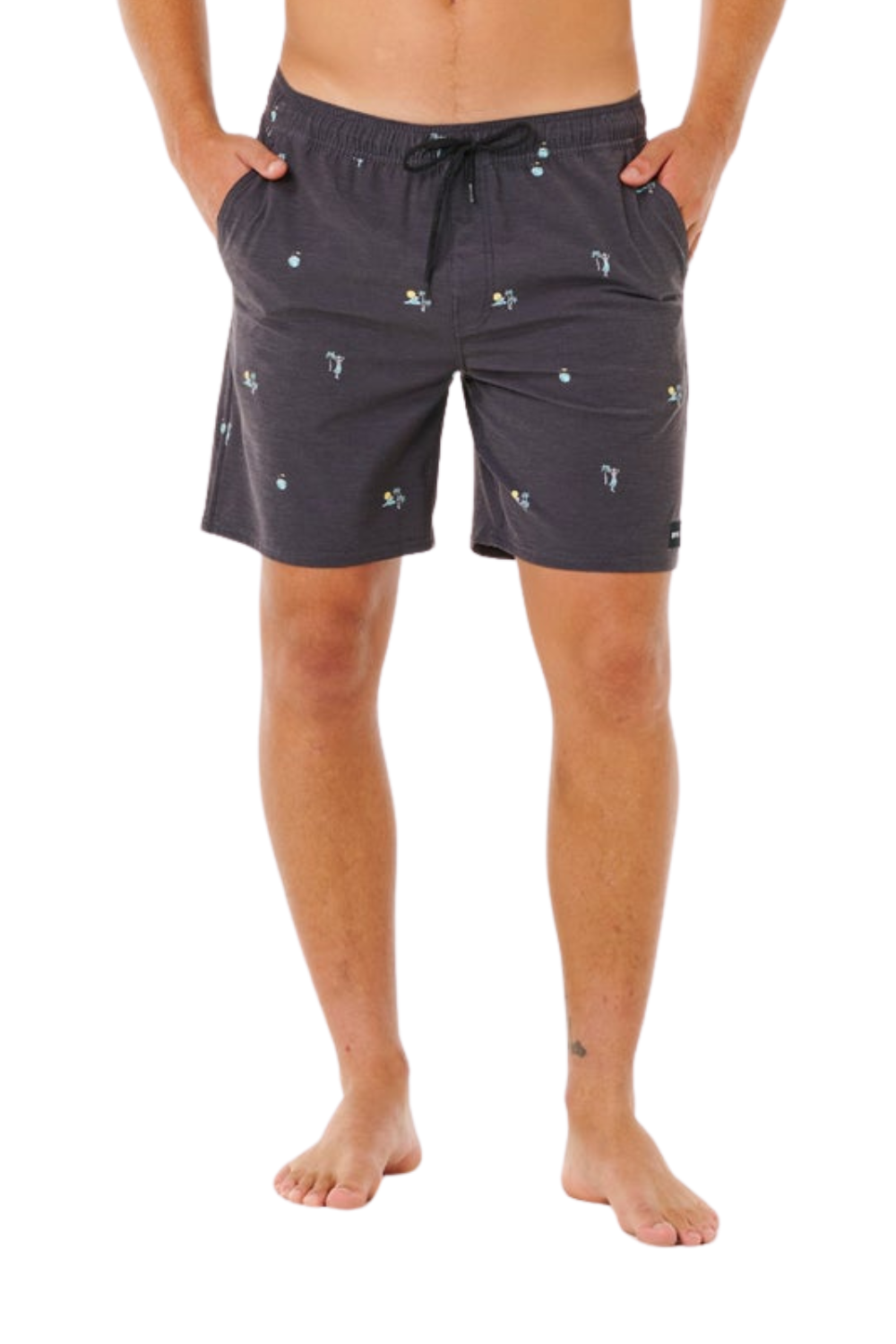 Person wearing black shorts with small allover prints on a white background