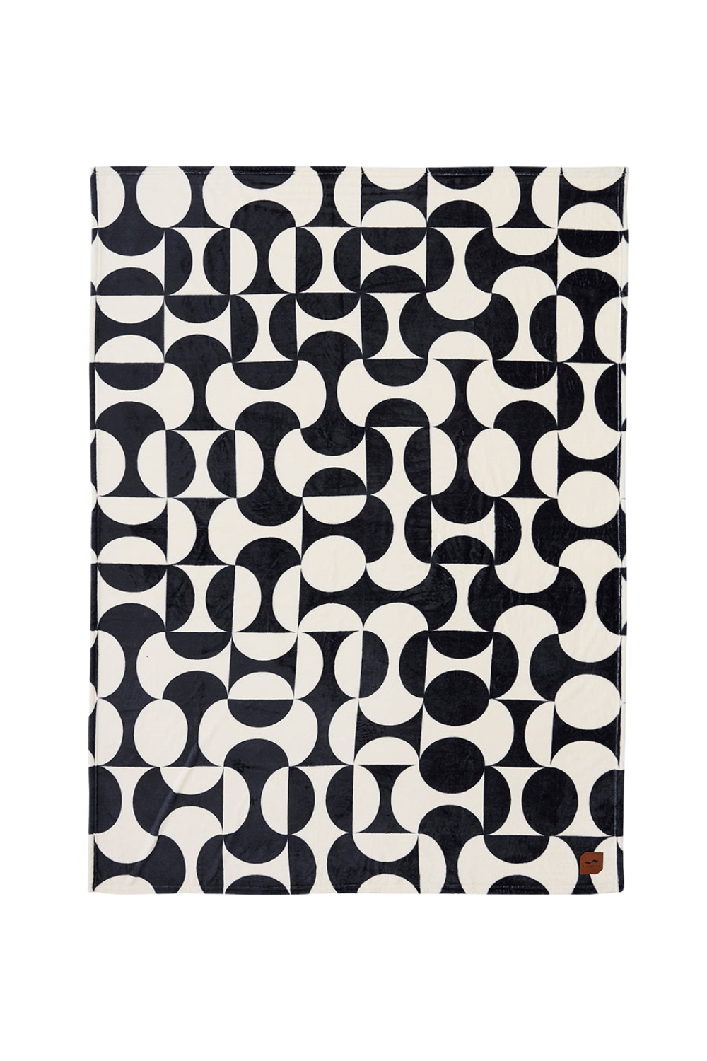 Patterned black and white blanket on a white background