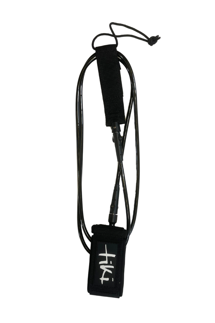 A black surf leash with a white logo, coiled and laid out on a plain background.