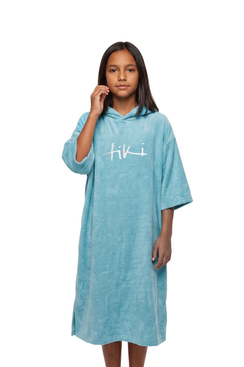 A young girl modeling a light blue hooded towel dress with a white 'hiki' logo on the chest, set against a plain white background.