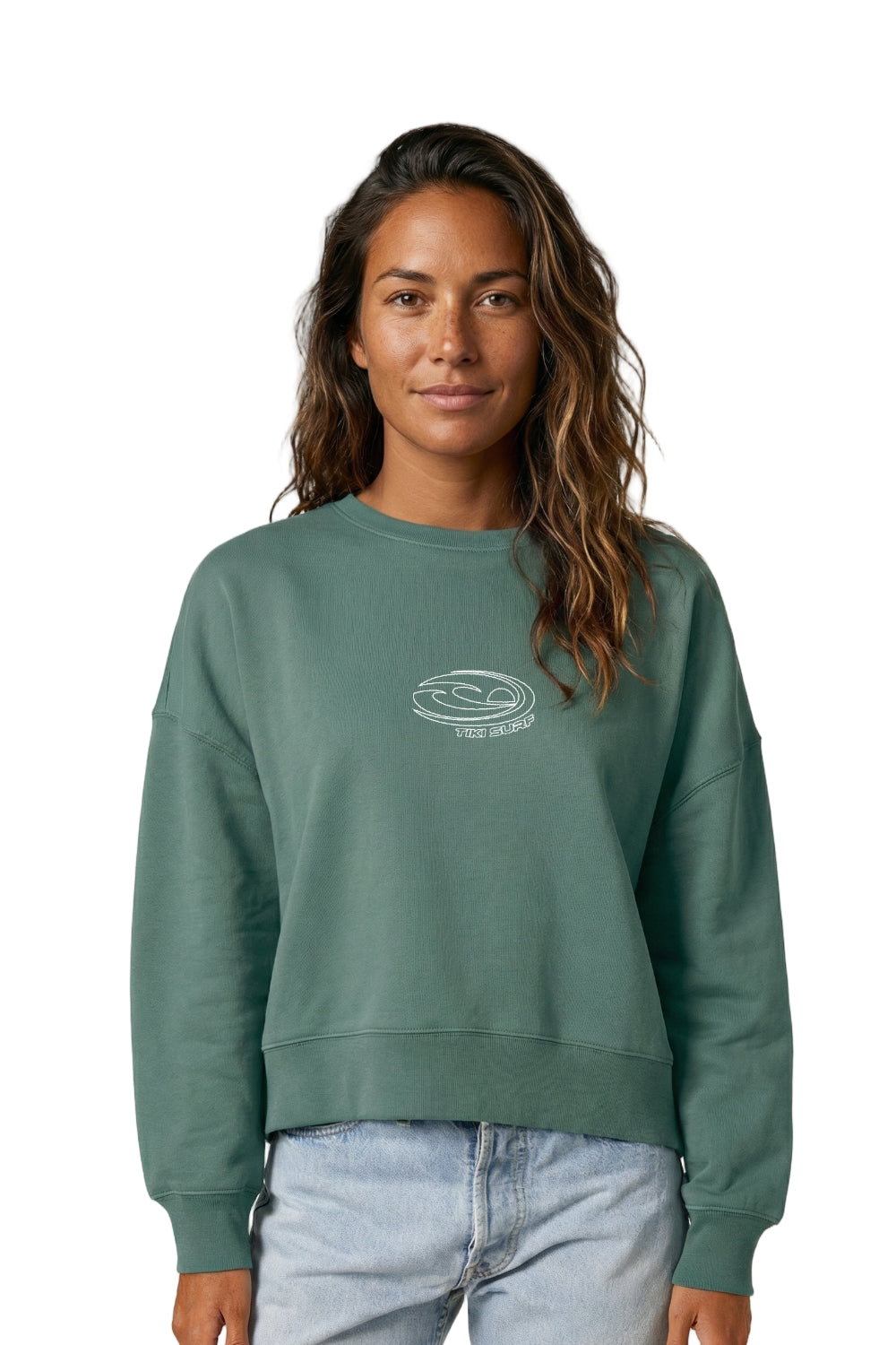 Woman wearing a green sweatshirt with a logo on a white background