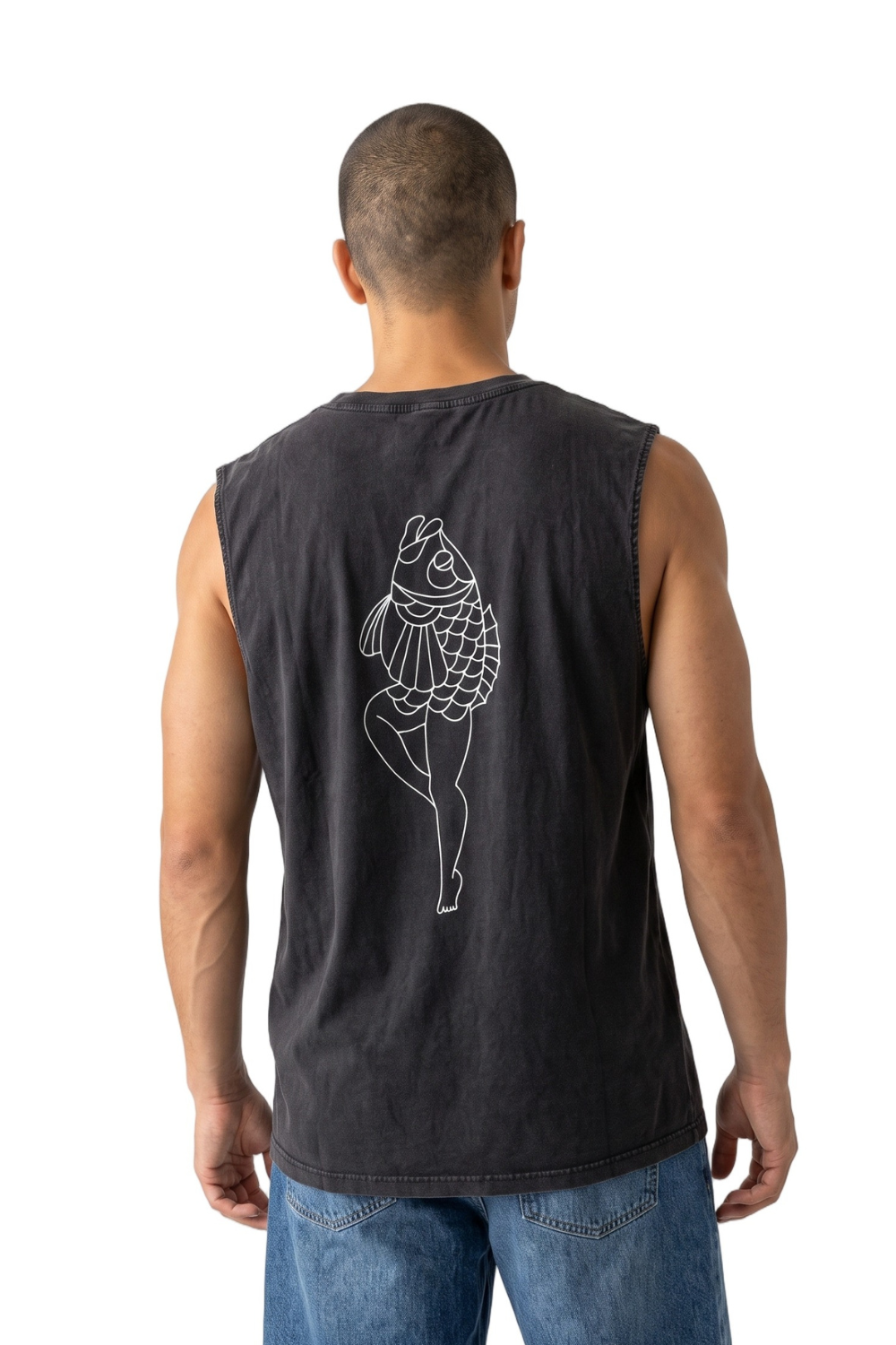 A man viewed from behind wearing a dark charcoal gray sleeveless tank top with a white line art graphic of a dancing fish on the back, paired with blue jeans against a white background.