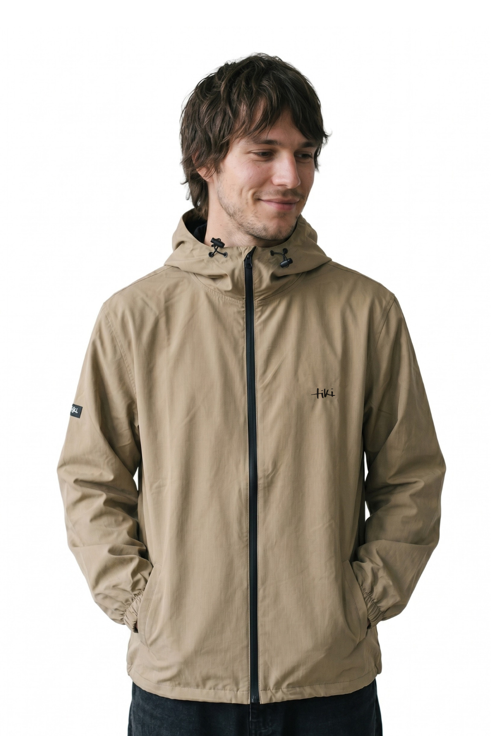 Man wearing a beige jacket with a hood on a white background