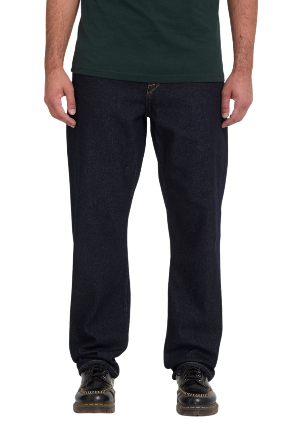 MAn wearing a pair of dark blue Volcom jeans