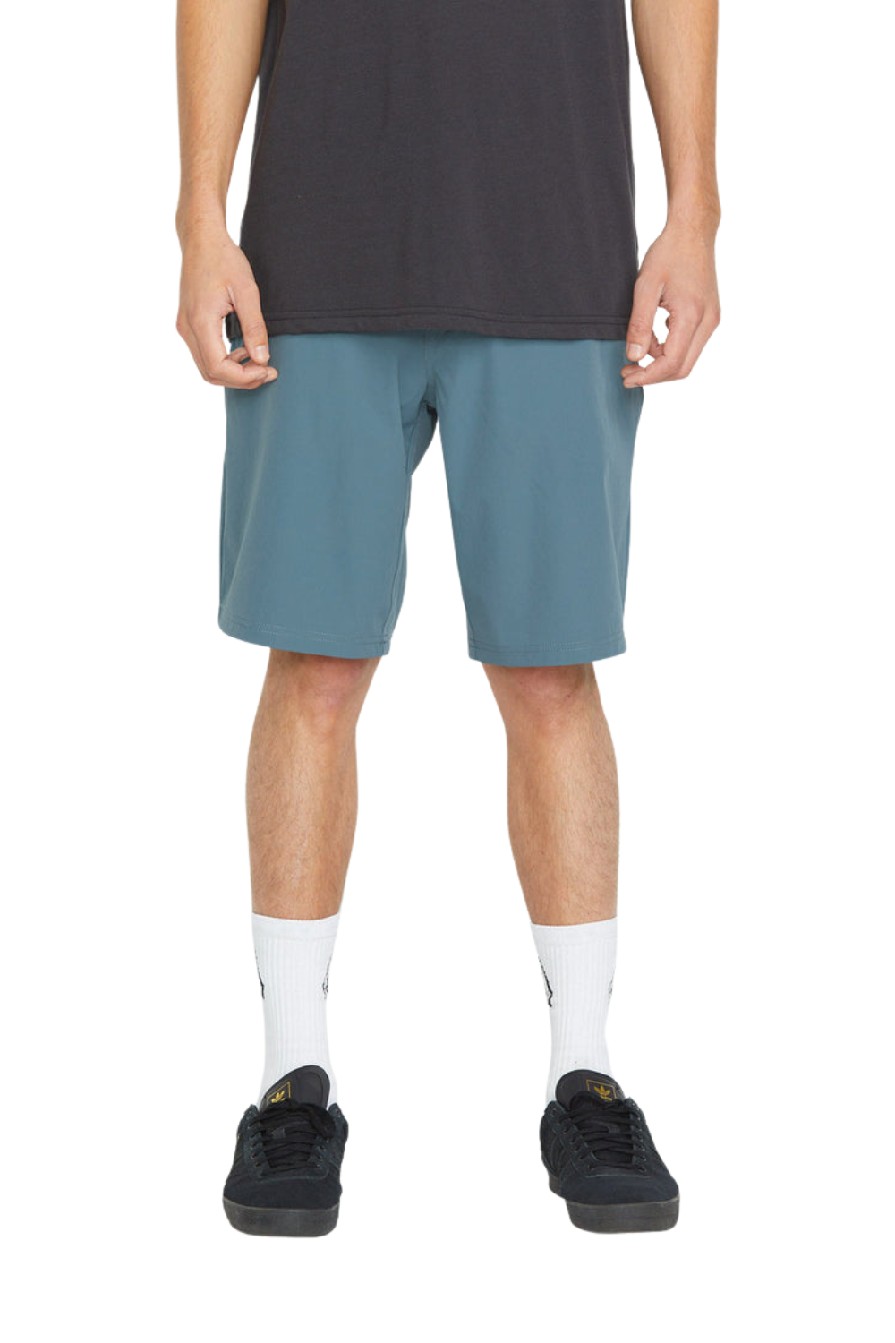 Person wearing a pair of slate coloured shorts