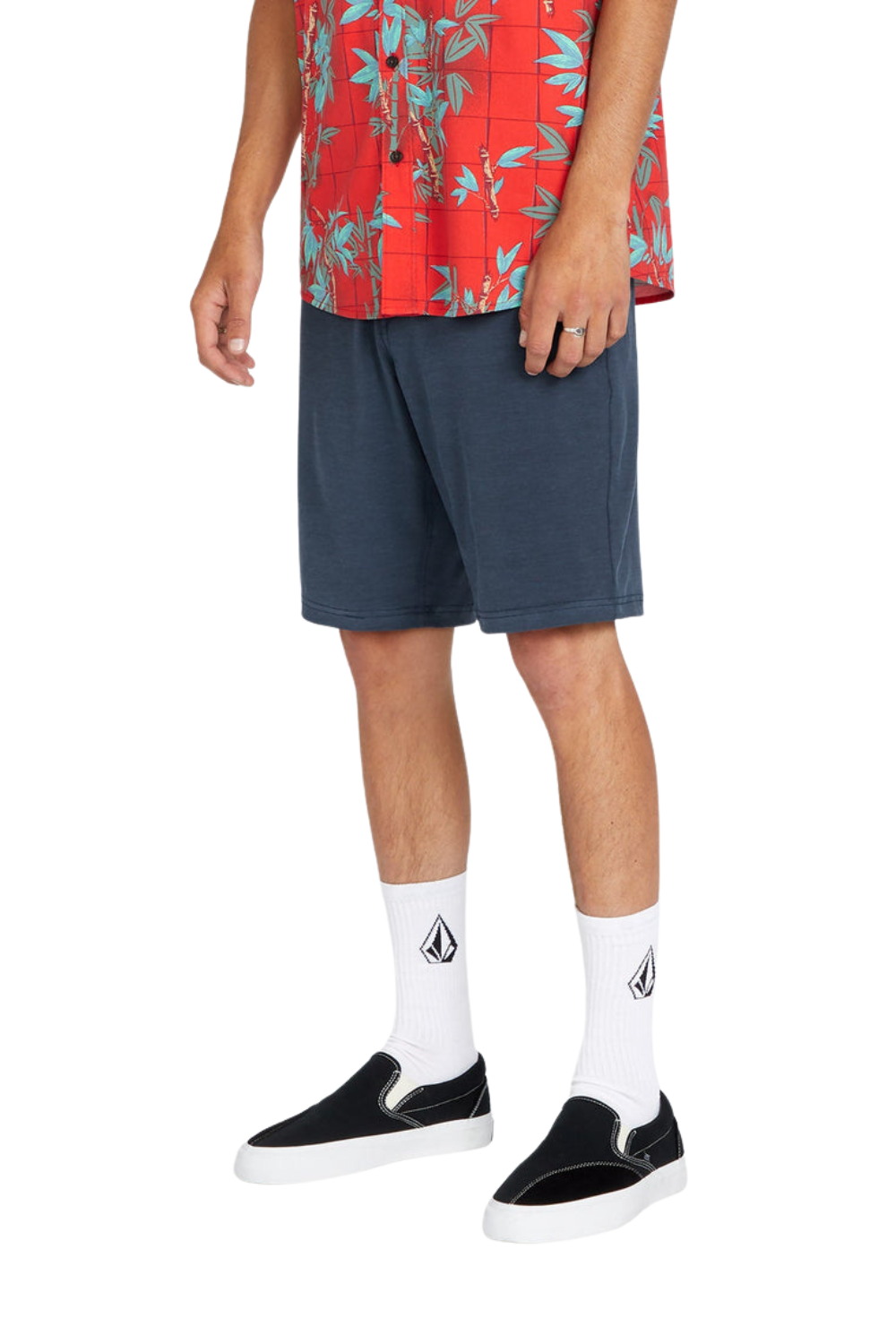 Person wearing a pair of blue Volcom shorts.