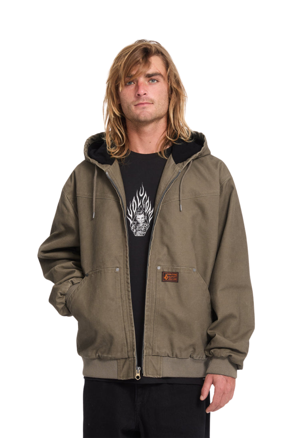 A man wearing an brown hooded Volcom work jacket over a black graphic t-shirt, photographed against a solid white background.