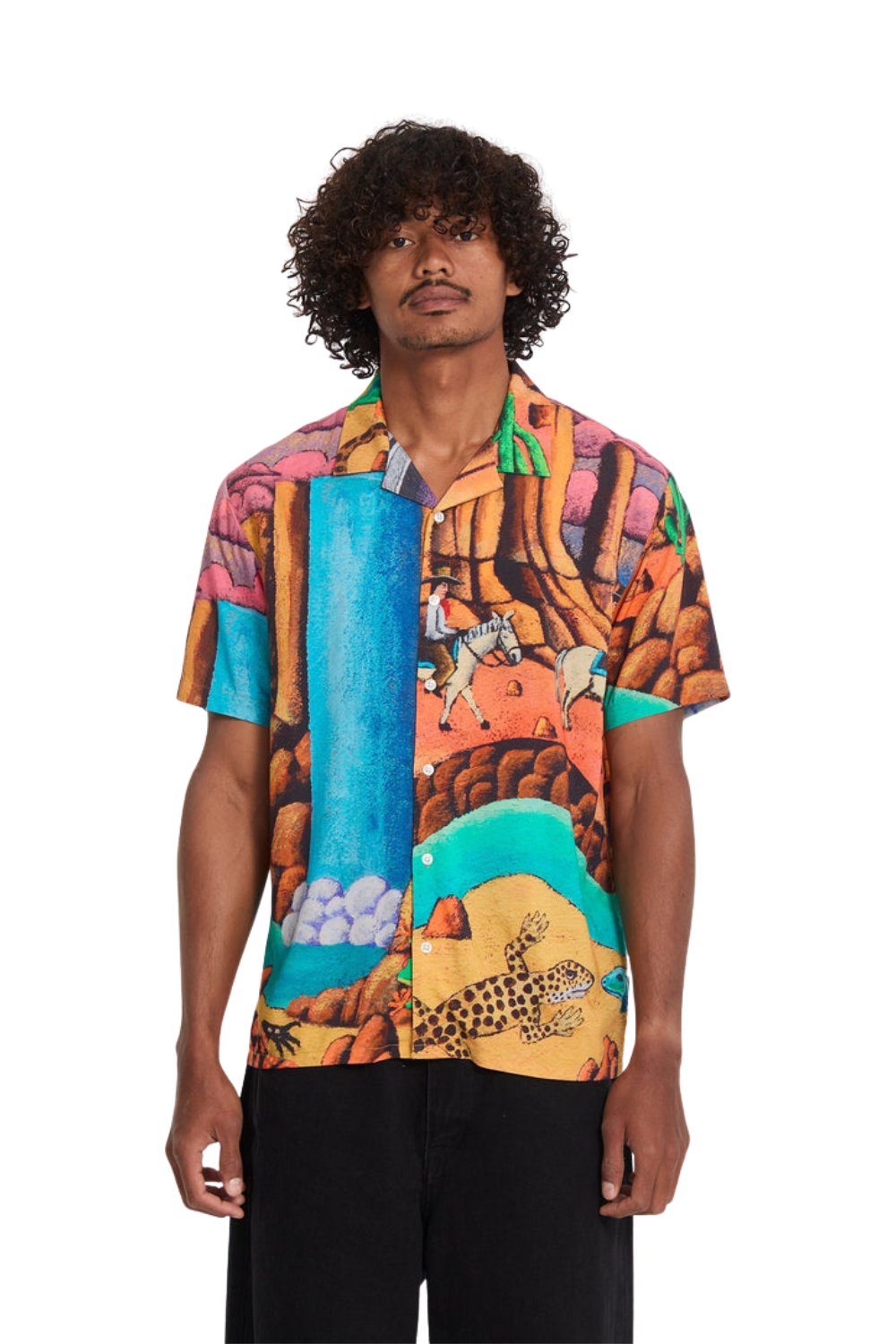 Man wearing a colorful patterned shirt with a white background