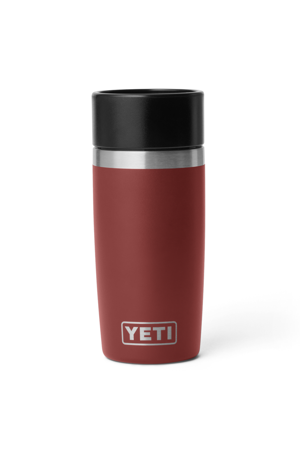 A YETI insulated travel tumbler in a matte dark red color, featuring a black lid and a silver stainless steel band near the top, with the YETI logo printed in white at the bottom.