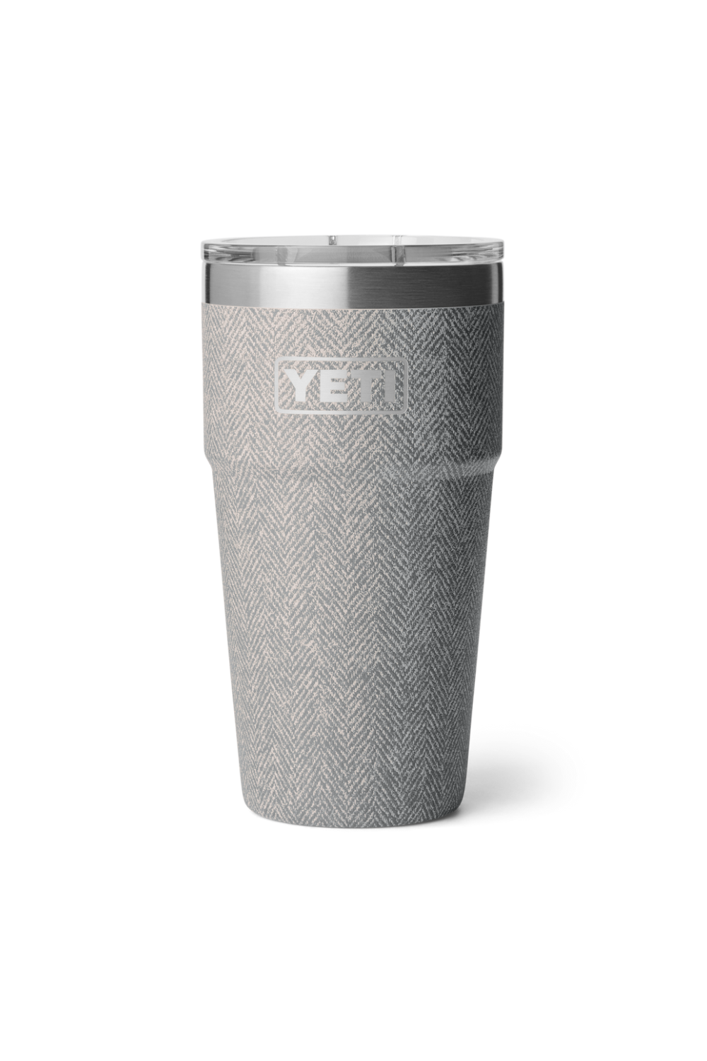 A gray herringbone-patterned insulated tumbler with a clear lid and a silver metallic rim, featuring the YETI logo on the front, set against a plain white background.