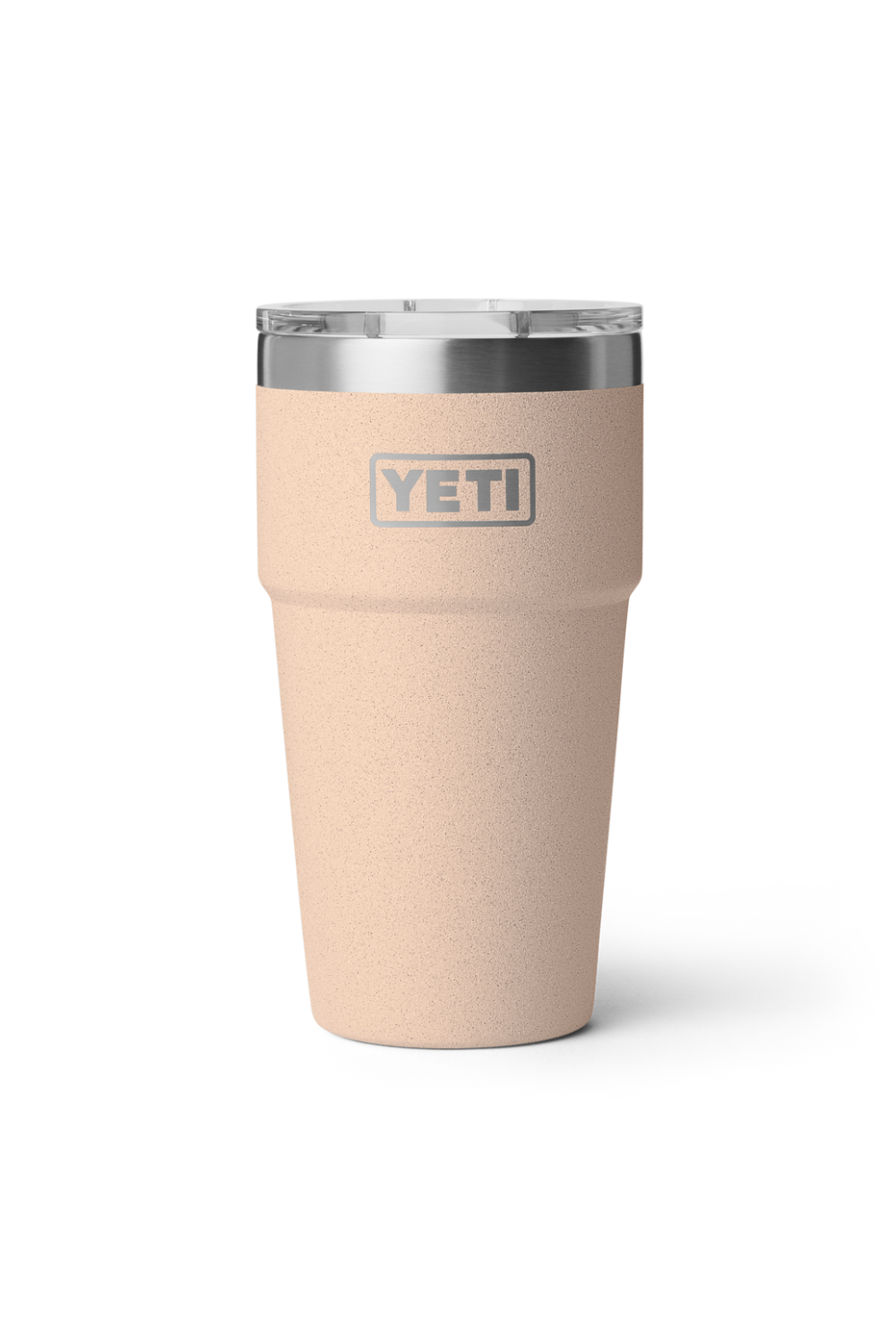 A YETI insulated travel tumbler in a light beige color with a clear lid and a silver stainless steel rim, shown on a white background.