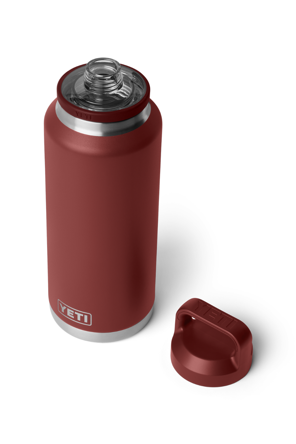 A YETI insulated water bottle in a deep red color, shown with its cap off and placed next to it on a clean white background.