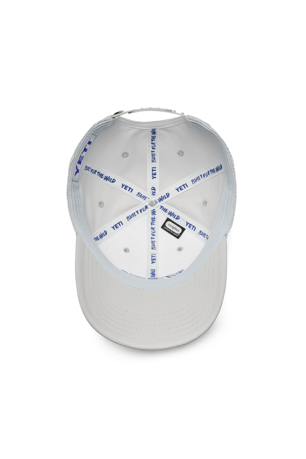 A white structured baseball cap shown from a top-down view, featuring blue 'BUILT FOR WILD  YETI' text printed repeatedly on the inside panels and a small black rectangular patch on the front.