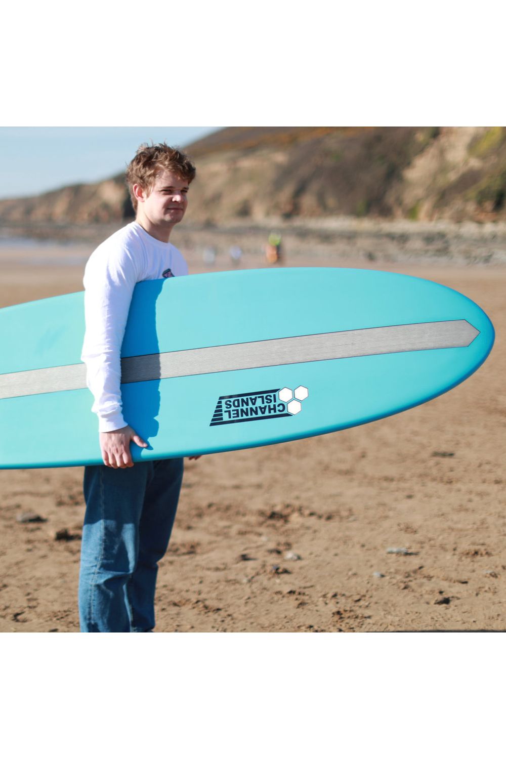 Torq Surfboard Xlite Chancho being held at the beach bottom.