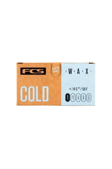A package of FCS surf wax labeled 'COLD' indicating it is for cold water temperatures.
